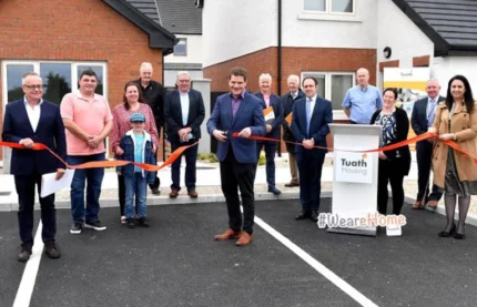 Minister Burke Officially Opens 14 Homes in Home County