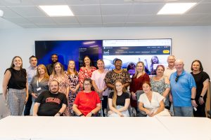 members of the Tenant Engagement Strategy 2026-2029 Working Group pose for photo in meeting room at Tuath office