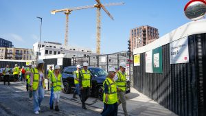 People in high vis jackets walking on a building site